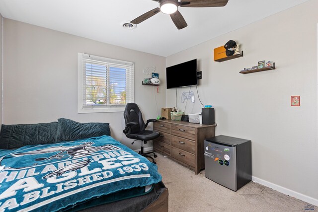 202 S B Ave, New Underwood, SD 57761 - bedroom with light carpet, a ceiling fan, and baseboards