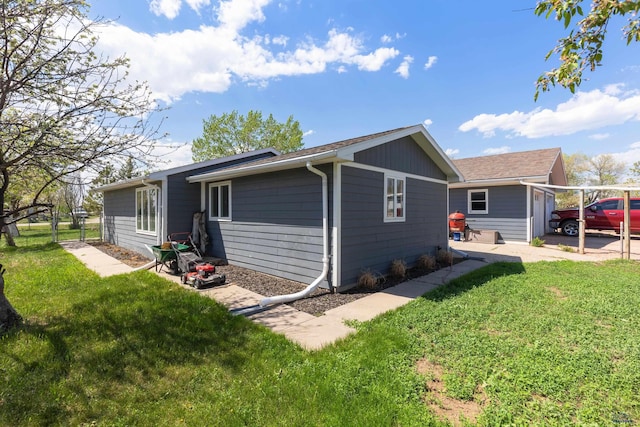 202 S B Ave, New Underwood, SD 57761 - view of property exterior with a yard