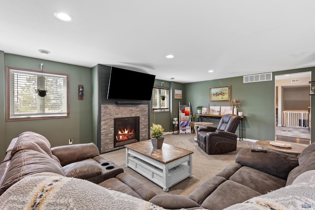 202 S B Ave, New Underwood, SD 57761 - living room with baseboards, carpet flooring, recessed lighting, and a stone fireplace