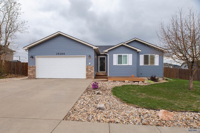 10284 Remmington St, Summerset, SD 57718 - single story home with concrete driveway, a garage, and brick siding