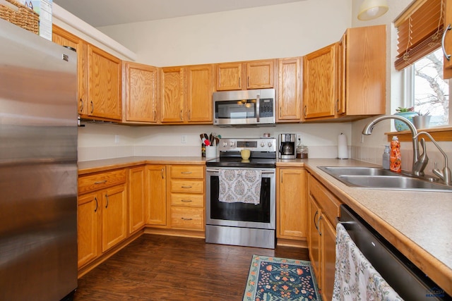10284 Remmington St, Summerset, SD 57718 - kitchen with stainless steel appliances, a sink, light countertops, and dark wood-type flooring