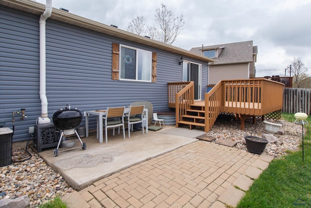 10284 Remmington St, Summerset, SD 57718 - rear view of house with a wooden deck, a patio area, and fence