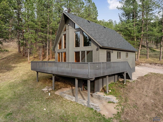 12087 Kaubisch Ranch Rd, Hill City, SD 57745 - rear view of house with roof with shingles and a deck