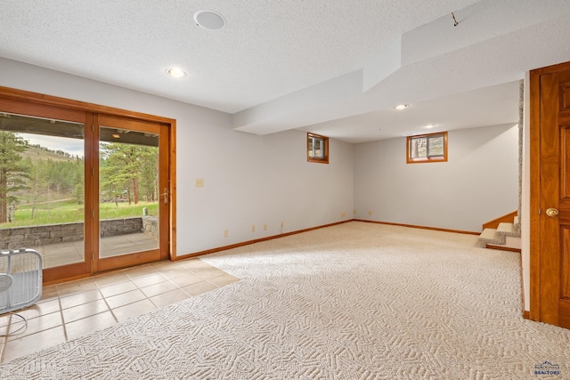 12087 Kaubisch Ranch Rd, Hill City, SD 57745 - below grade area featuring stairway, baseboards, light carpet, recessed lighting, and a textured ceiling