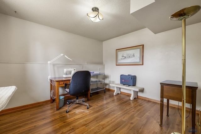 3204 Flint Dr, Rapid City, SD 57702 - office area featuring wood finished floors, baseboards, and a textured ceiling