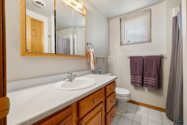 3204 Flint Dr, Rapid City, SD 57702 - full bathroom featuring vanity, tile patterned floors, and toilet