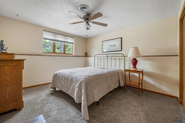3204 Flint Dr, Rapid City, SD 57702 - carpeted bedroom with a textured ceiling, baseboards, and a ceiling fan