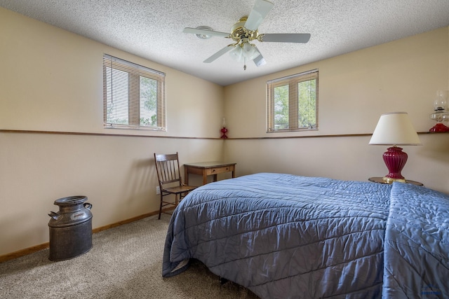 3204 Flint Dr, Rapid City, SD 57702 - carpeted bedroom featuring a textured ceiling, baseboards, and a ceiling fan