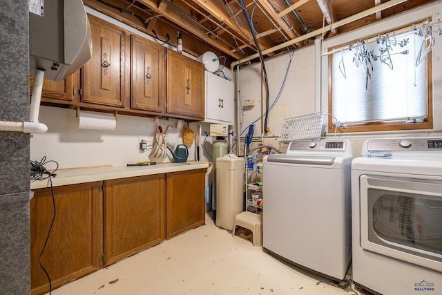 3204 Flint Dr, Rapid City, SD 57702 - washroom with cabinet space and washing machine and dryer