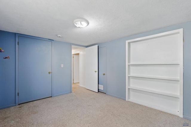 5753 Pluto, Rapid City, SD 57703 - unfurnished bedroom with carpet floors, baseboards, and a textured ceiling