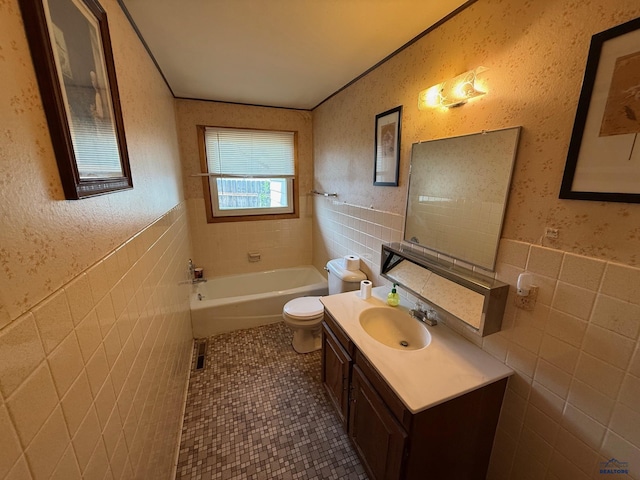 full bath featuring tile walls, toilet, tile patterned flooring, a tub to relax in, and vanity
