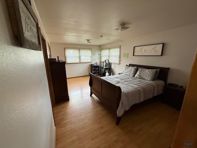 bedroom with wood finished floors
