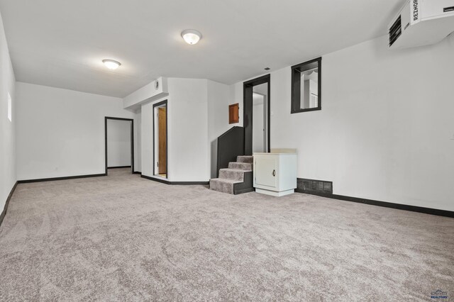 4648 Carol, Rapid City, SD 57703 - unfurnished living room featuring carpet flooring, baseboards, and stairway