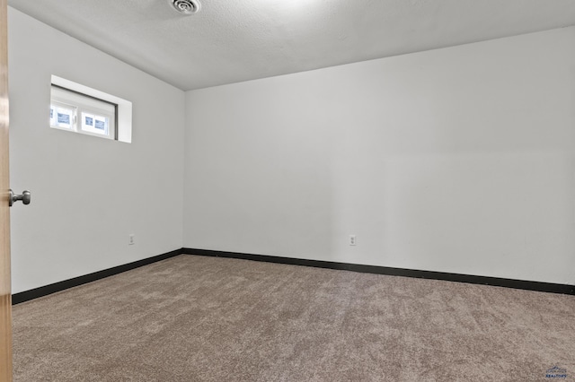 4648 Carol, Rapid City, SD 57703 - carpeted empty room featuring baseboards and a textured ceiling