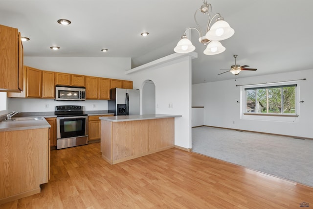 573 Plover Dr, Box Elder, SD 57719 - kitchen featuring appliances with stainless steel finishes, a sink, lofted ceiling, open floor plan, and ceiling fan