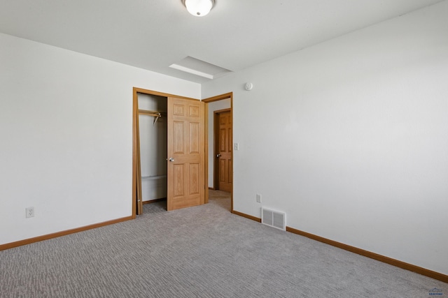 573 Plover Dr, Box Elder, SD 57719 - unfurnished bedroom with baseboards, carpet, and a closet