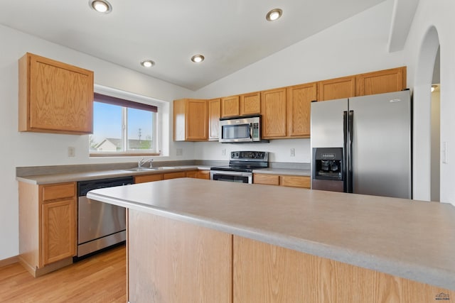 573 Plover Dr, Box Elder, SD 57719 - kitchen featuring stainless steel appliances, a sink, lofted ceiling, light wood-type flooring, and recessed lighting