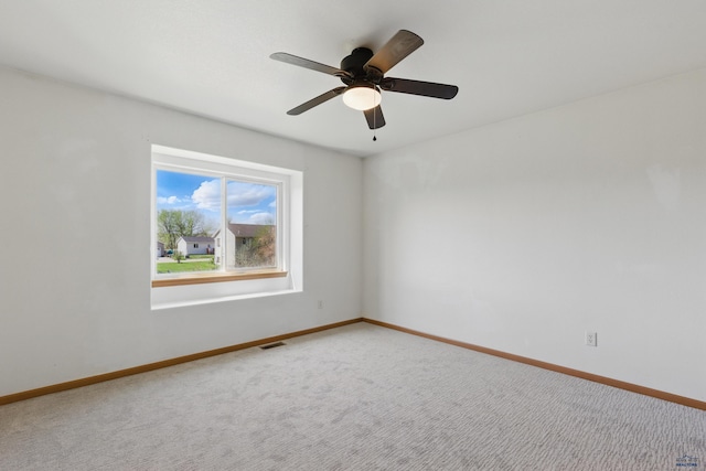 573 Plover Dr, Box Elder, SD 57719 - spare room with carpet, baseboards, and ceiling fan