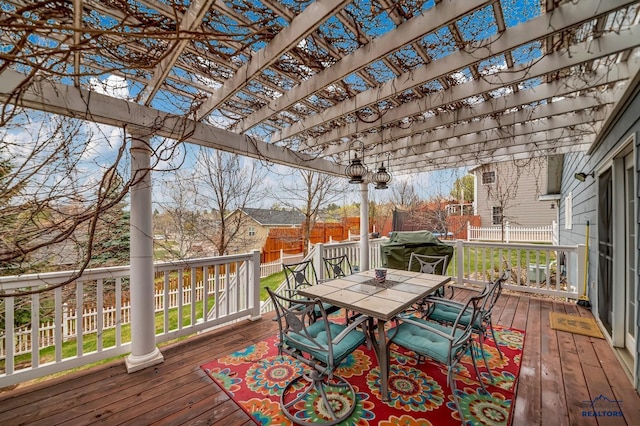2930 Princeton Ct, Rapid City, SD 57702 - deck with outdoor dining area, a pergola, and fence