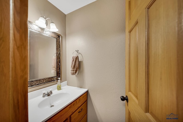 2930 Princeton Ct, Rapid City, SD 57702 - bathroom with vanity and a textured wall