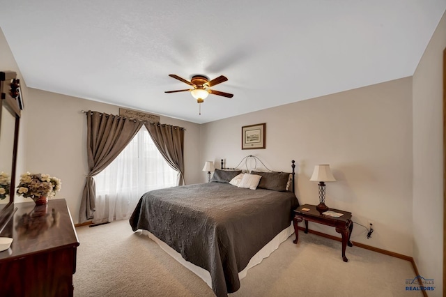 2930 Princeton Ct, Rapid City, SD 57702 - bedroom with light colored carpet, baseboards, and a ceiling fan
