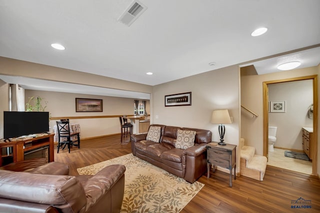 2930 Princeton Ct, Rapid City, SD 57702 - living area featuring baseboards, wood finished floors, and recessed lighting
