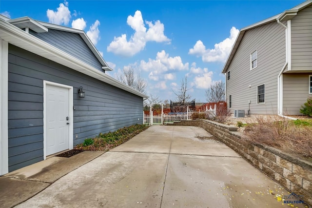 2930 Princeton Ct, Rapid City, SD 57702 - view of side of property with central AC unit, a patio, fence, and driveway