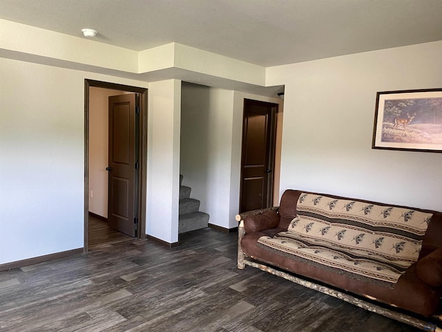 1064 Quinn Dr, Hill City, SD 57745 - sitting room featuring wood finished floors, baseboards, and stairs