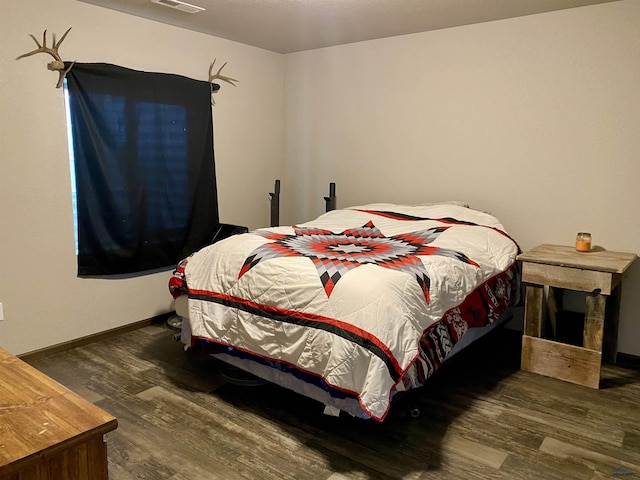 1064 Quinn Dr, Hill City, SD 57745 - bedroom featuring wood finished floors and baseboards