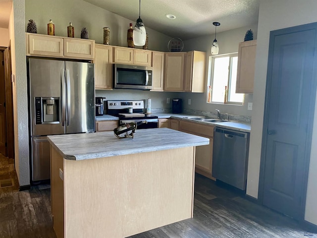 1064 Quinn Dr, Hill City, SD 57745 - kitchen with appliances with stainless steel finishes, a sink, light brown cabinetry, dark wood finished floors, and a textured ceiling