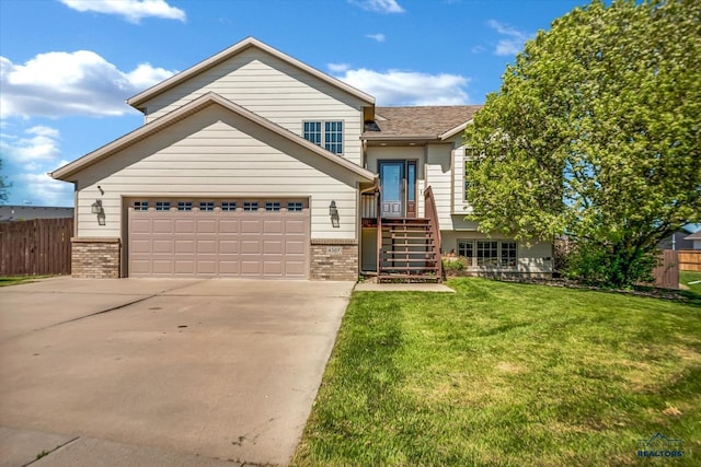 4307 Henry Ct, Rapid City, SD 57701 - view of front of home with brick siding, driveway, and a garage