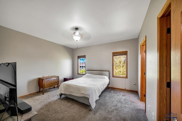 4307 Henry Ct, Rapid City, SD 57701 - carpeted bedroom featuring baseboards and a ceiling fan