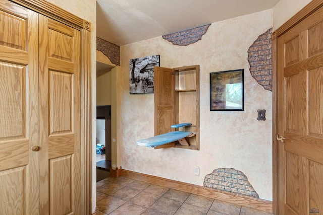 2030 12th Ave, Belle Fourche, SD 57717 - hallway with tile patterned flooring and baseboards
