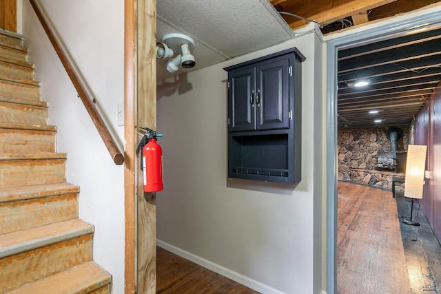 2030 12th Ave, Belle Fourche, SD 57717 - staircase featuring wood finished floors and baseboards