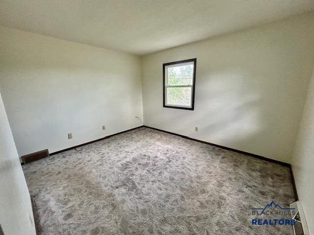 1504 Morningside Dr, Rapid City, SD 57701 - carpeted spare room featuring baseboards