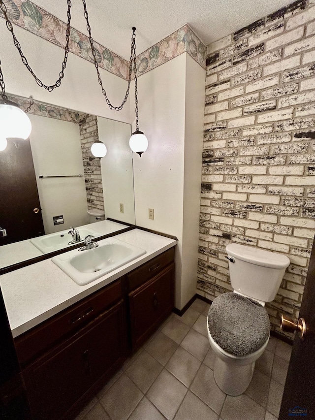 1504 Morningside Dr, Rapid City, SD 57701 - half bathroom featuring a textured ceiling, toilet, vanity, and tile patterned floors