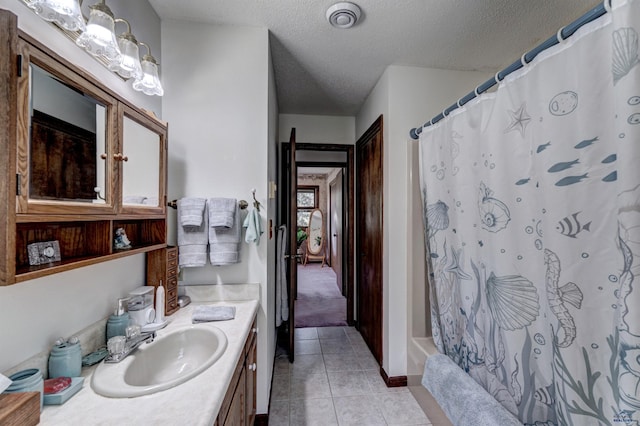 4240 Foothill Dr, Rapid City, SD 57702 - bathroom featuring vanity, a textured ceiling, tile patterned flooring, and curtained shower