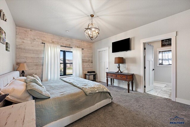 8009 Brooks Loop, Spearfish, SD 57783 - carpeted bedroom with multiple windows, a chandelier, and baseboards