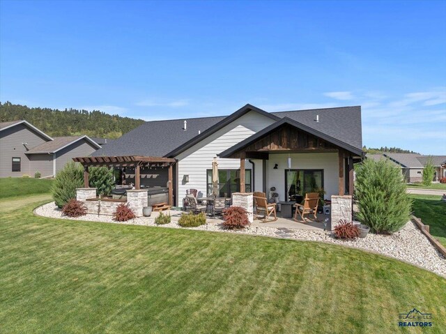 8009 Brooks Loop, Spearfish, SD 57783 - rear view of house with a pergola, a patio area, a lawn, and roof with shingles