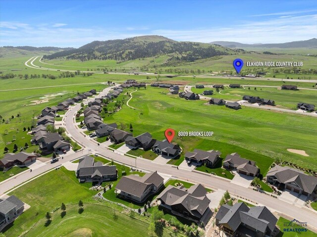 8009 Brooks Loop, Spearfish, SD 57783 - aerial view of residential area featuring a mountainous background and a golf club
