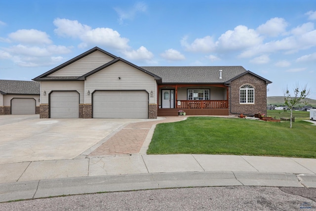 960 Nicole St, Rapid City, SD 57701 - ranch-style house featuring a porch, brick siding, a garage, and a front lawn