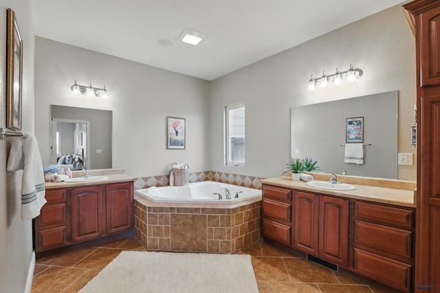 960 Nicole St, Rapid City, SD 57701 - bathroom with tile patterned floors, two vanities, and a garden tub