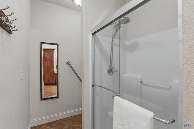 960 Nicole St, Rapid City, SD 57701 - full bathroom featuring a shower stall, baseboards, and tile patterned flooring
