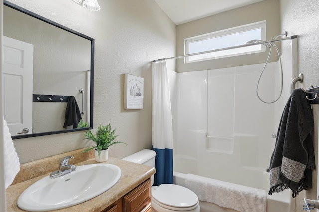 960 Nicole St, Rapid City, SD 57701 - full bath with toilet, shower / bathtub combination with curtain, a textured wall, and vanity