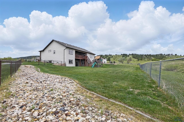 960 Nicole St, Rapid City, SD 57701 - view of yard featuring a deck, stairway, and a rural view