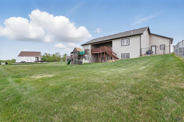 960 Nicole St, Rapid City, SD 57701 - rear view of house with stairs, a playground, and a deck