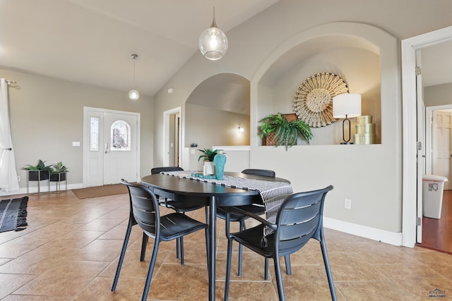 960 Nicole St, Rapid City, SD 57701 - tiled dining space featuring vaulted ceiling and baseboards