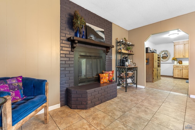 2739 W W St, Anne, Rapid City, SD 57701 - living room featuring arched walkways, light tile patterned flooring, and a textured ceiling