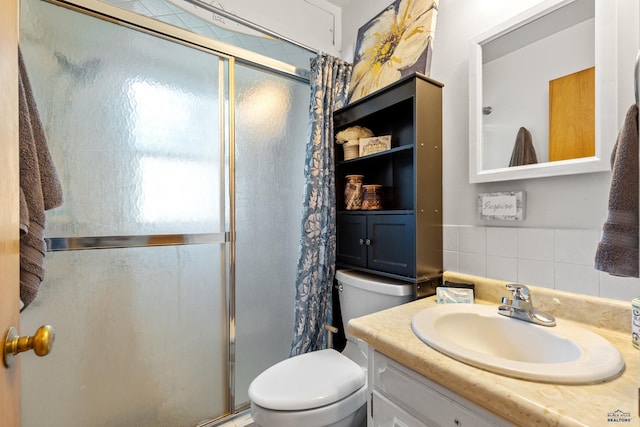 2739 W W St, Anne, Rapid City, SD 57701 - bathroom with a shower stall, toilet, vanity, and decorative backsplash