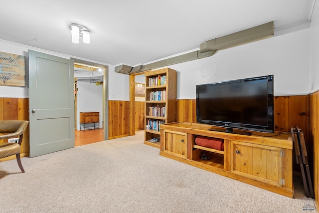 2739 W W St, Anne, Rapid City, SD 57701 - carpeted living area featuring wooden walls, a wainscoted wall, and ornamental molding